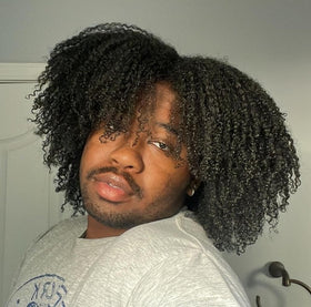 Kinky Curly shampoo in bathroom use rinsing buildup away for softer hair