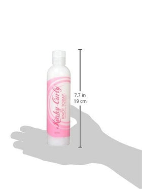 Kinky Curly label close-up highlighting directions and visible ingredient benefits