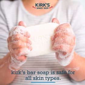 Kirk's stacked bars beside a ruler to show 4-ounce size and durable, long-lasting bar benefit