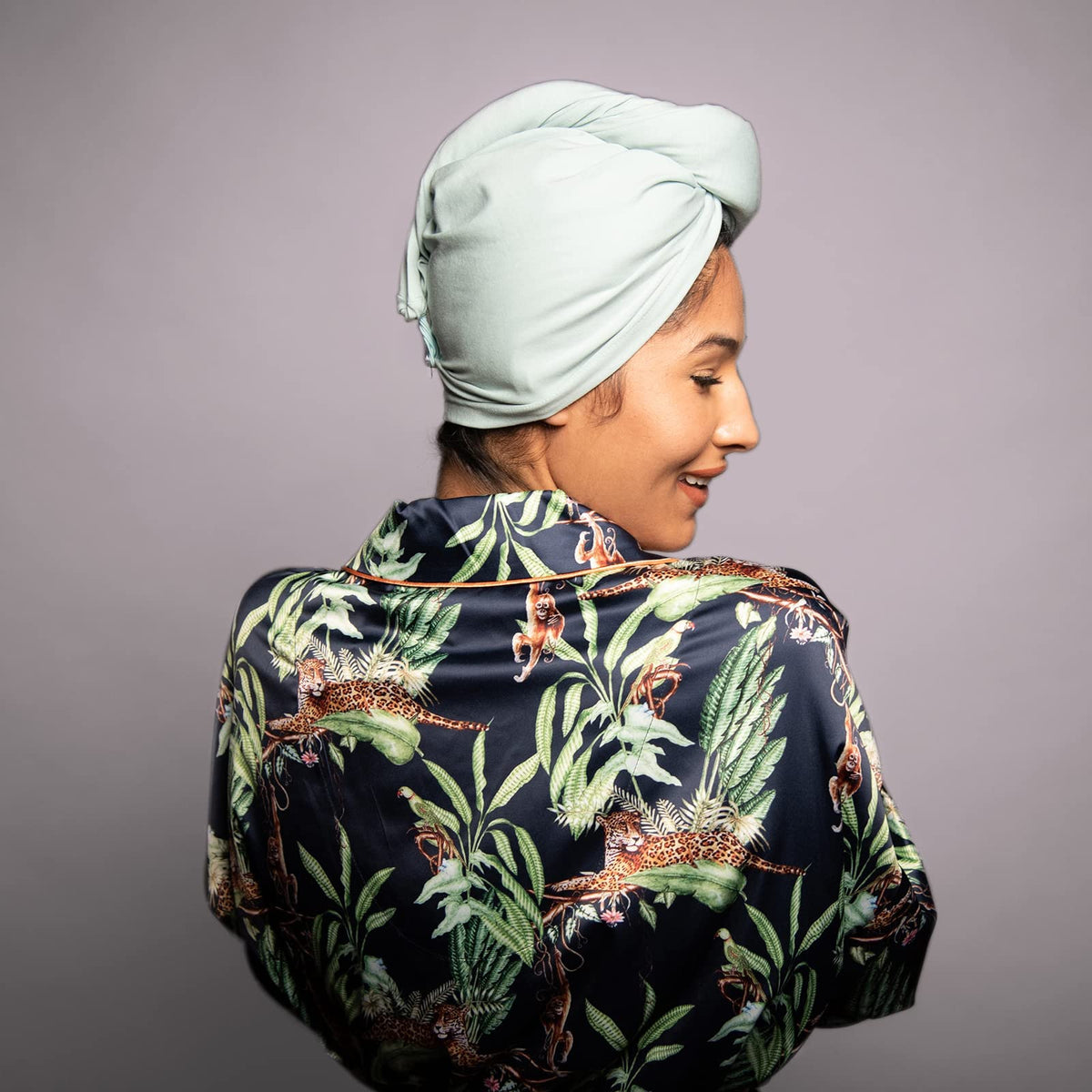 KISMETICS care label inside turban showing fabric info and long-lasting use benefit