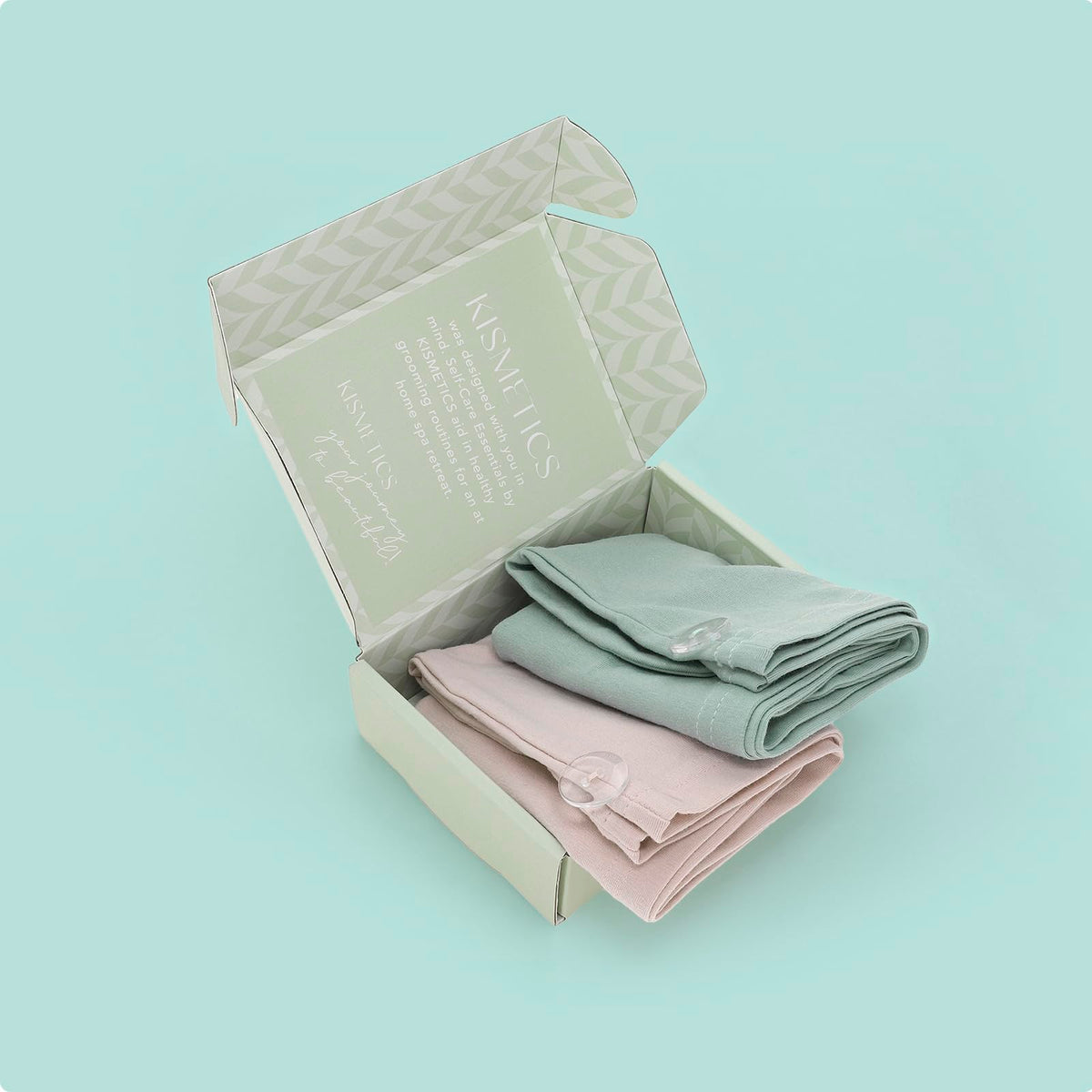 KISMETICS turbans on bathroom vanity styled as gift-ready self-care setup benefit