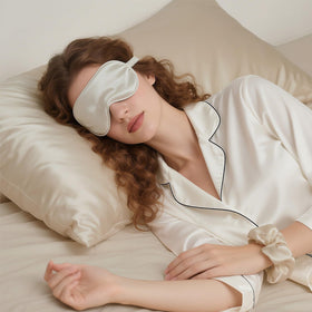 KISMETICS sleep set styled on bedside table suggesting luxurious nightly routine