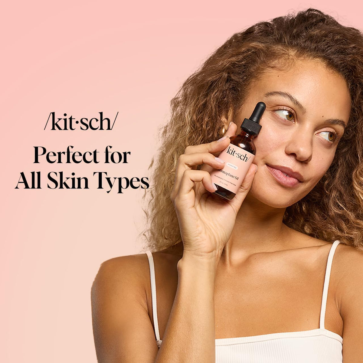 Kitsch face oil beside a credit card showing 2oz size and portable scale