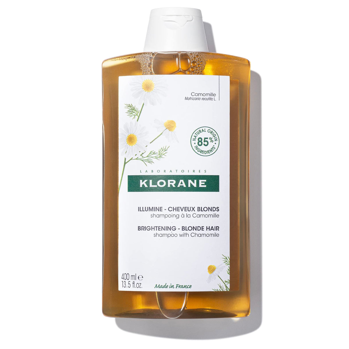 Klorane front packaging of chamomile brightening shampoo showing label and size benefits