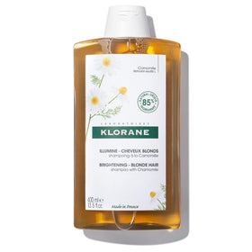 Klorane front packaging of chamomile brightening shampoo showing label and size benefits