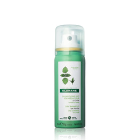 Klorane front packaging of travel-size nettle dry shampoo shows compact convenience