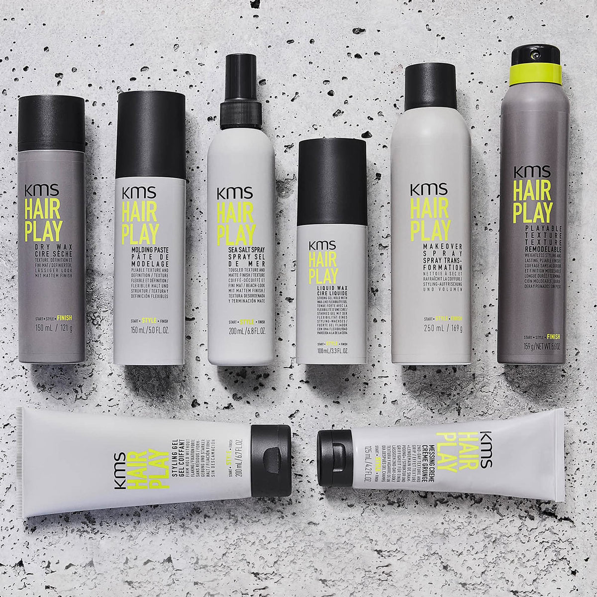 KMS bottle beside hand to show 200ml scale and convenient size