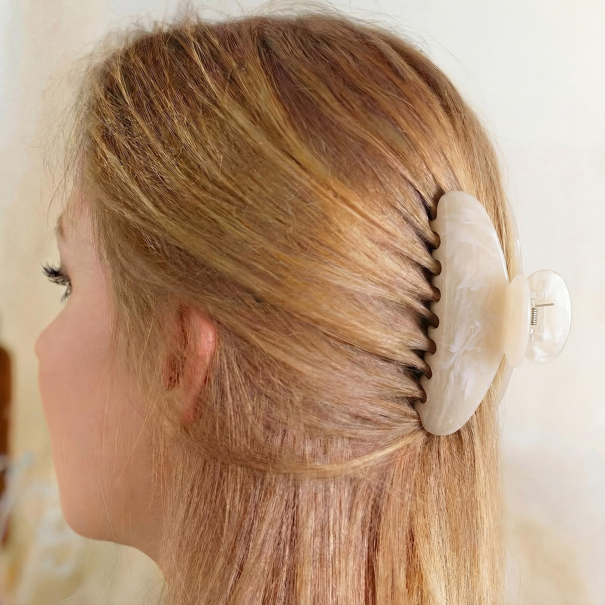 Knitgrip worn in a half-up hairstyle illustrating a polished look