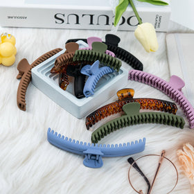 Koceci clips held in hand showing true size and travel convenience