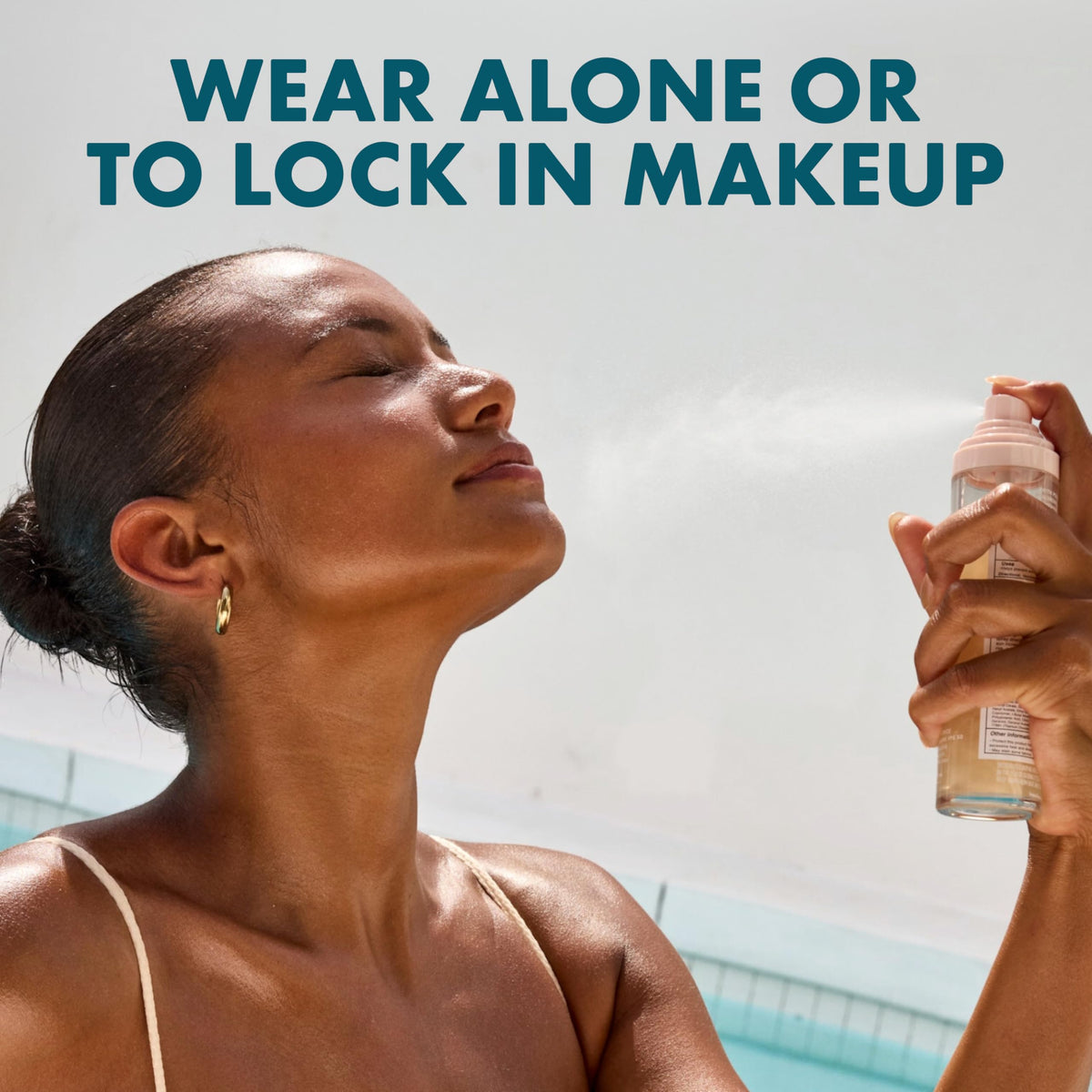 Kopari Sunglaze used over finished makeup for long-lasting set and protection