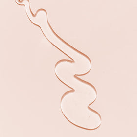 Kopari bottle in shower setting demonstrating in-use cleansing benefit