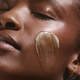 KORA Organics balm emulsified with water showing easy rinsing benefit