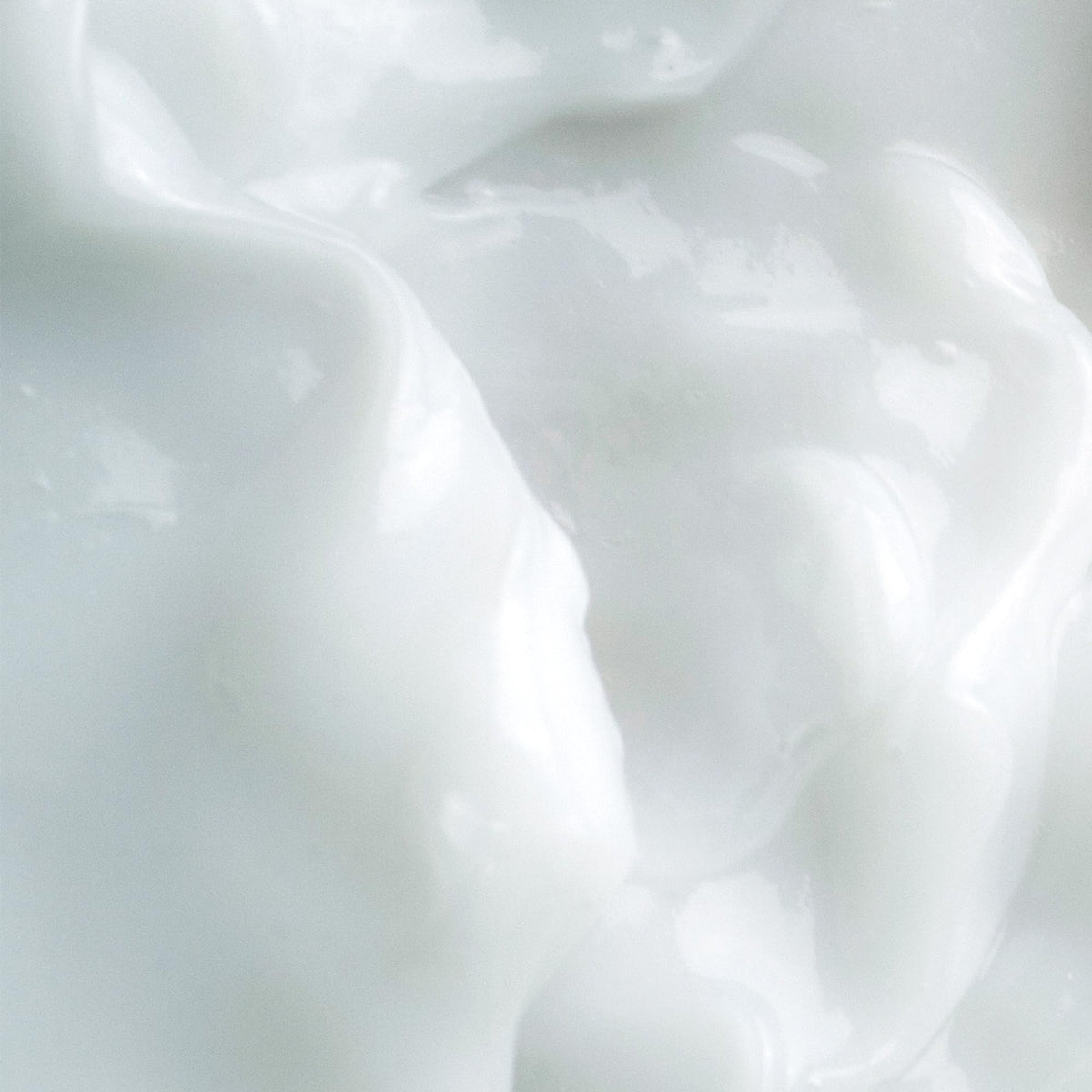 KORA Organics open jar revealing creamy texture, highlights hydrating, non-greasy feel