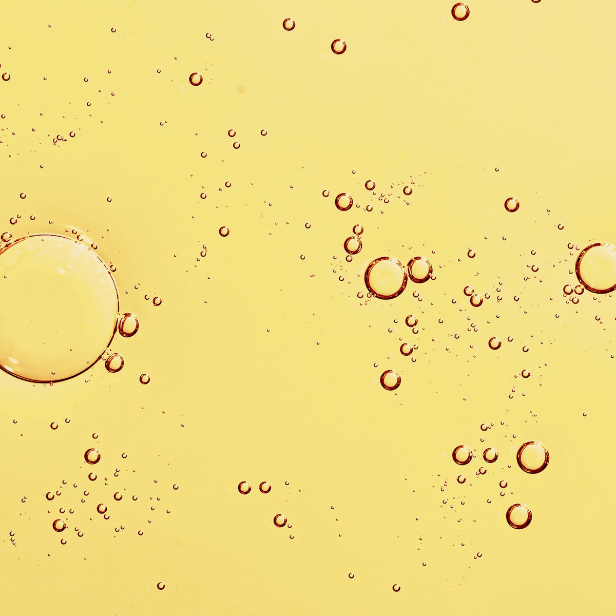 KORA Organics dropper dispensing oil to show silky lightweight texture