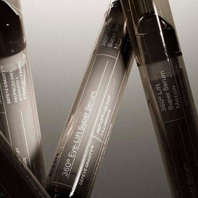 KORRES applying serum to upper eyelid demonstrating lift-targeted application and smoothing benefit