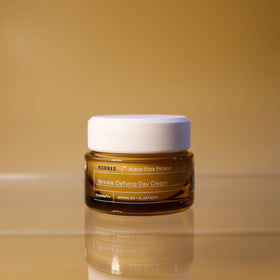 KORRES applying cream on hand demonstrating fast absorption and plumping benefit