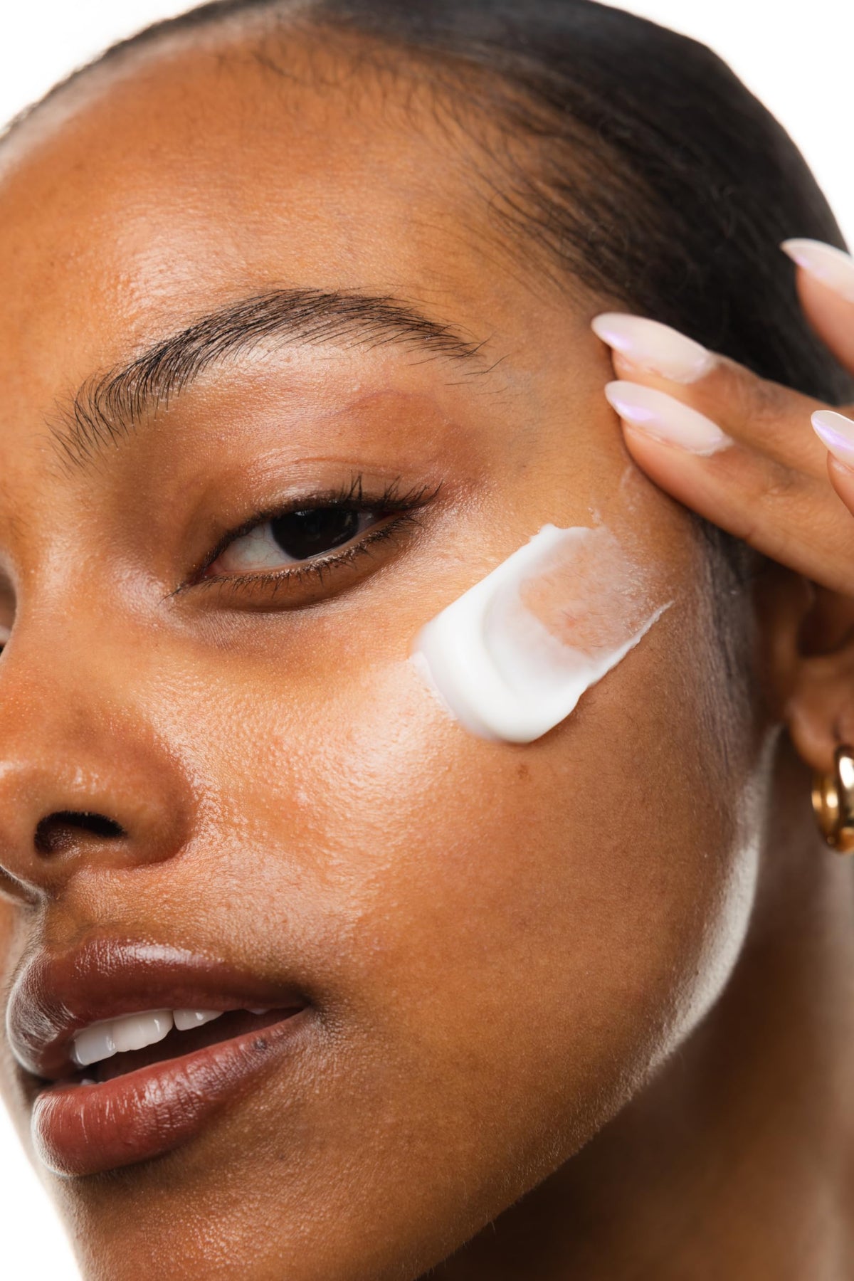 KORRES moisturizer being smoothed on face to show breathable, non-greasy finish