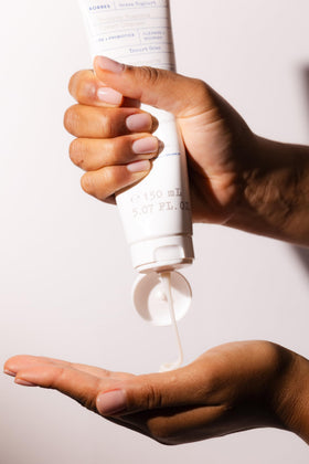 KORRES open tube with product drop showing cream consistency and easy dosing benefit