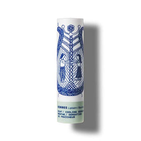 KORRES lifestyle image of model applying balm offering fresh mint sensation and natural shine benefit