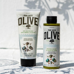 KORRES olive branch near jar to emphasize pure Greek olive oil origin and natural benefits