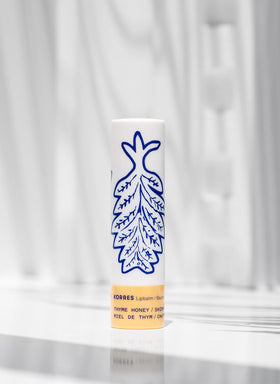 KORRES applied on lips in lifestyle shot, demonstrates subtle golden shimmer