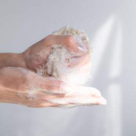 KORRES dispenser releasing foam into hand for gentle cleansing