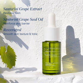 KORRES close-up texture of Santorini Grape oil-serum showing silky finish
