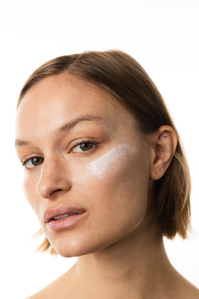 KORRES sunscreen on cheek close-up demonstrating natural finish
