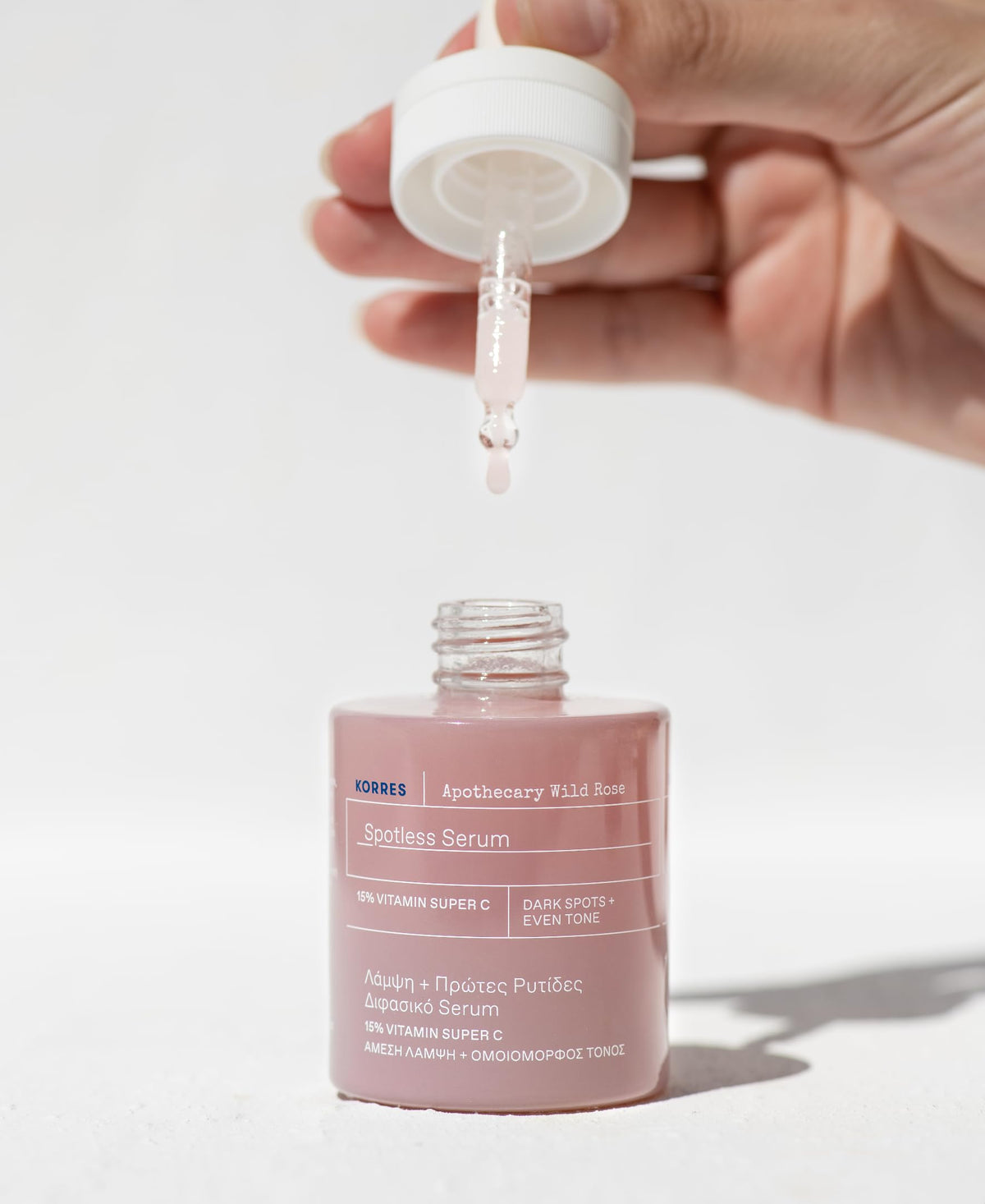 KORRES serum droplet on fingertip ready to apply for quick absorption