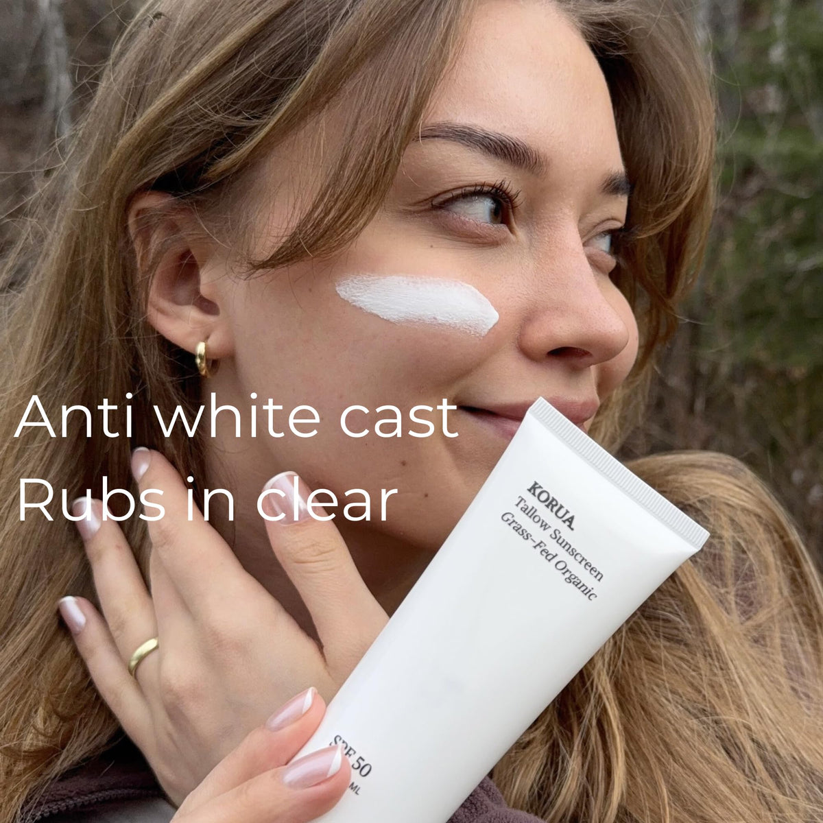 KORUA applying sunscreen on hand demonstrating easy spreadability