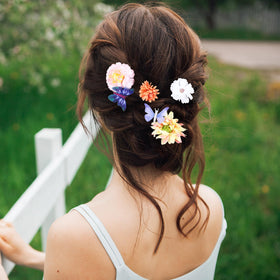KorViSHOW hair styling image with clips securing braid and adding flair