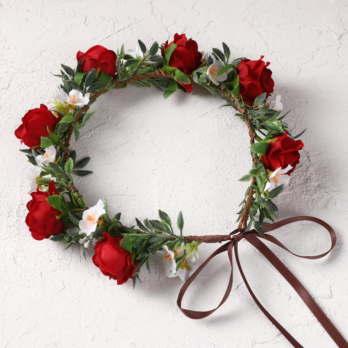 KorViSHOW rose crown scale next to hand showing lightweight construction for all-day wear