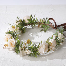 KorViSHOW bride wearing white flower crown outdoors adds romantic charm to wedding attire