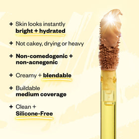 Kosas concealer size comparison next to coin illustrating travel-friendly compactness