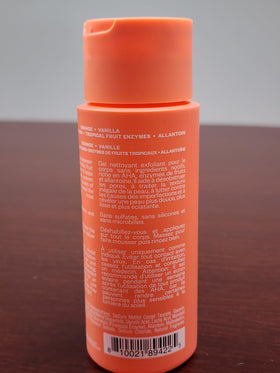 Kosas bottle held in hand for scale and travel-friendly size