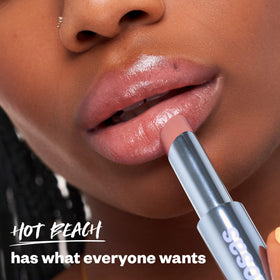 Kosas Wet Stick creamy texture swatch illustrating glossy hydration