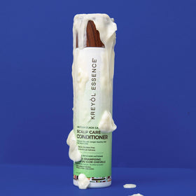 Kreyol Essence on bathroom shelf in a lifestyle setting suggesting daily use
