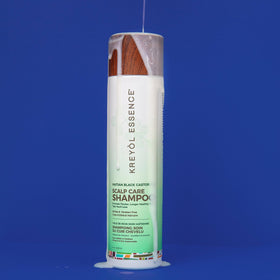 KREYÒL ESSENCE bottle in hand for scale and easy travel-size benefit