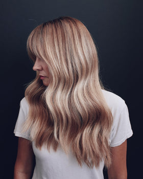 Side-by-side before and after using Kristin Ess showing neutralized brass