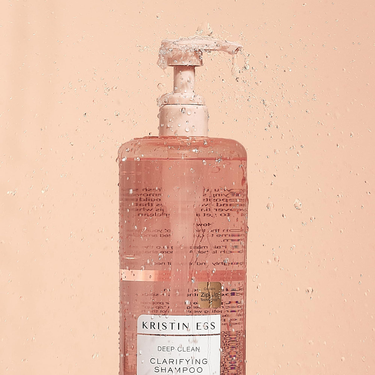 Kristin Ess close-up of shampoo texture highlighting deep-clean feel