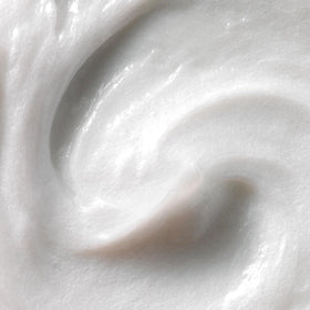Kristin Ess conditioner texture close-up highlighting creamy slip