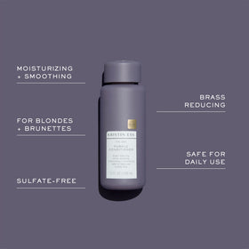 Kristin Ess hand applying shampoo to wet hair for easy use