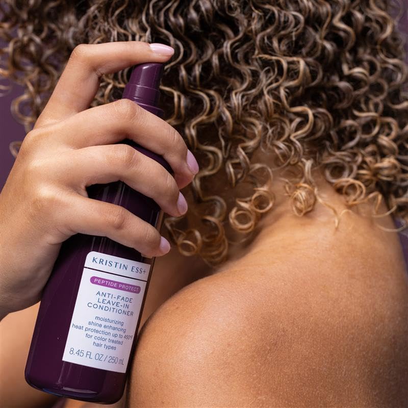 Kristin Ess fine mist spray demonstrating even application and lightweight feel