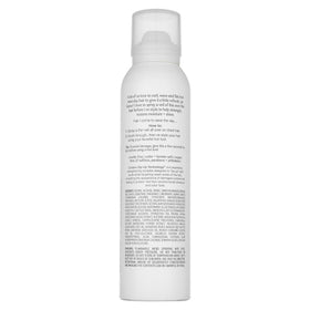 Kristin Ess balm stick texture close-up highlighting smooth oil-rich finish