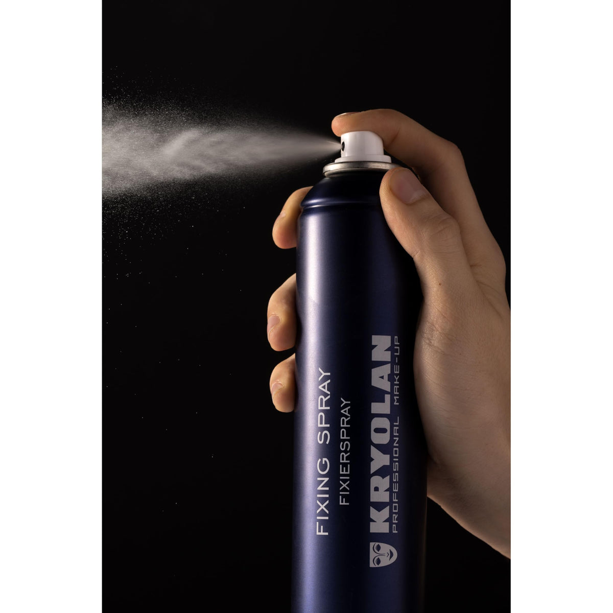 Kryolan fixing spray applied on model to lock theatrical and everyday makeup