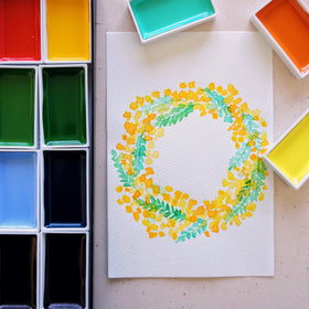 Kuretake paints staged in a studio to show creative workspace use