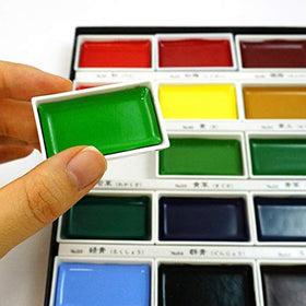 Kuretake close-up of large pans highlighting smooth pigment texture