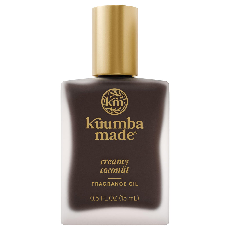 Kuumba Made front bottle showing cream coconut scent and compact size benefit