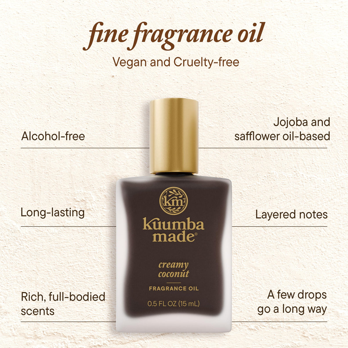 Kuumba Made bottle held in hand showing 0.5 oz travel-friendly benefit