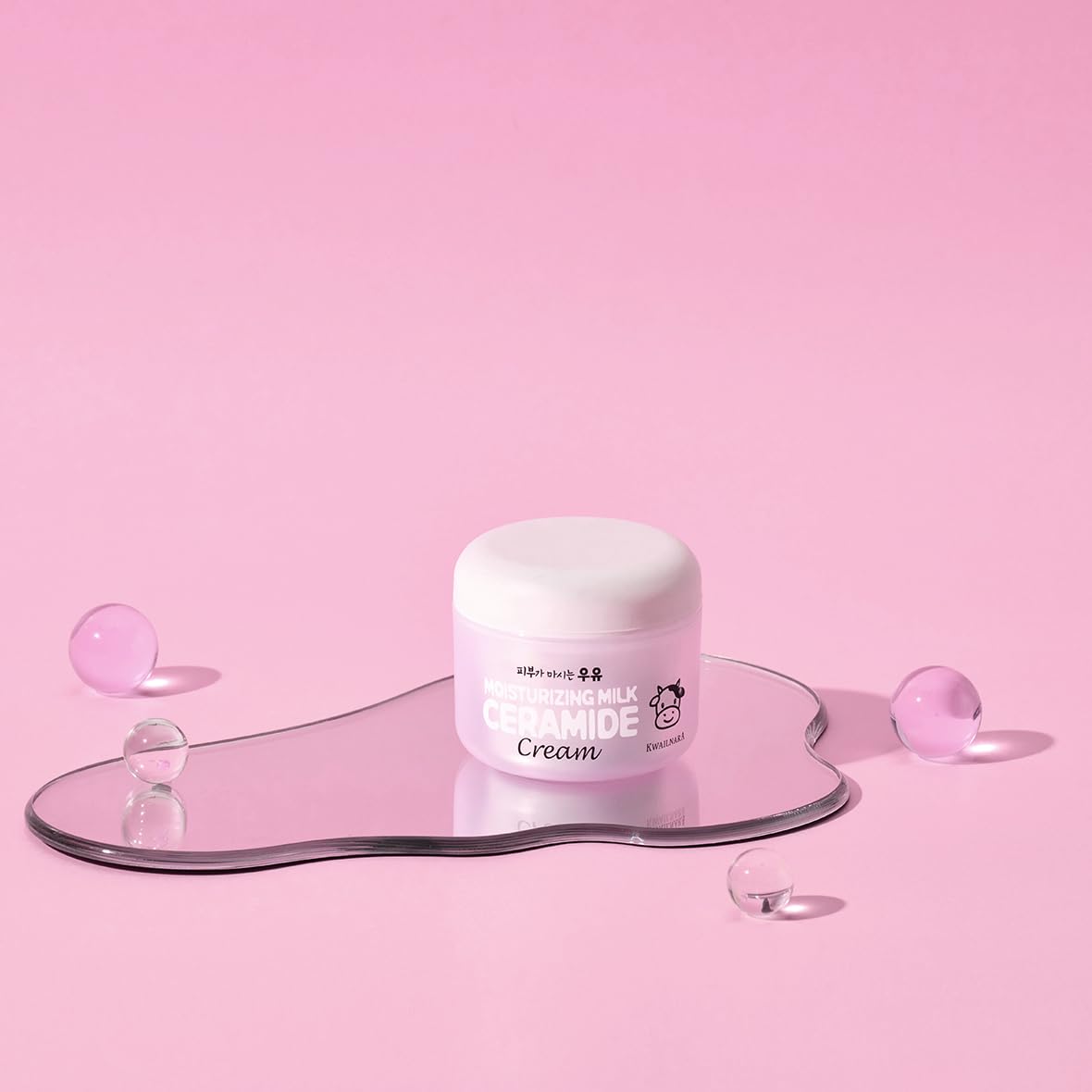 Kwailnara next to a ruler showing 3.38 fl oz scale for size and travel convenience
